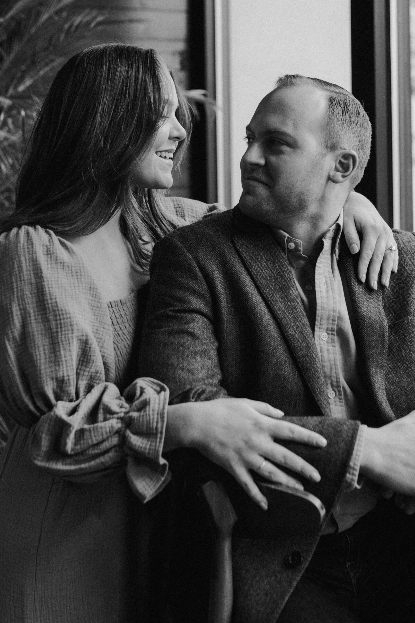 A couple in a suit + white dress take engagement photos at a brewery in Madison, WI by Claire Neville Photography 