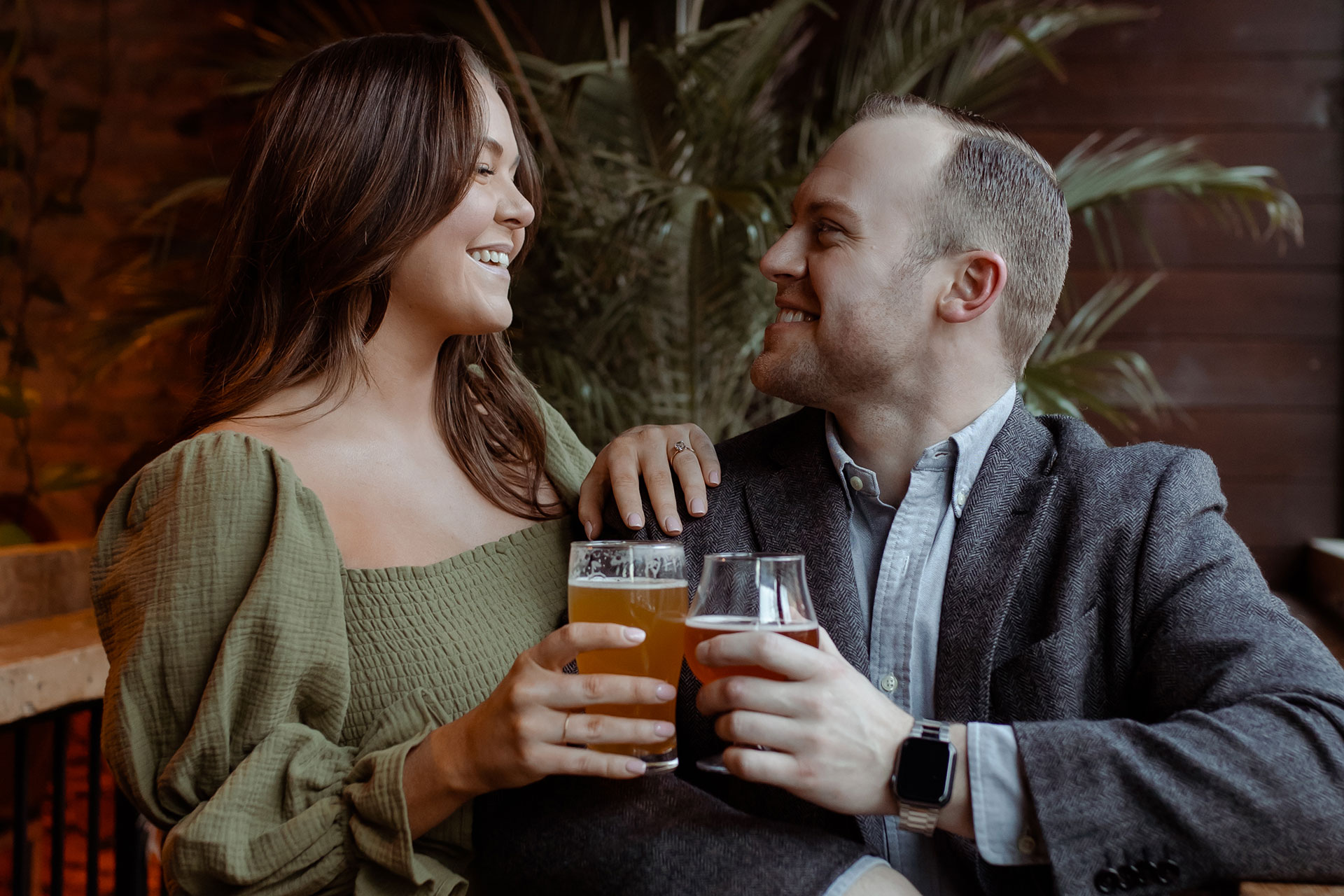 A couple in a suit + white dress take engagement photos at a brewery in Madison, WI by Claire Neville Photography 