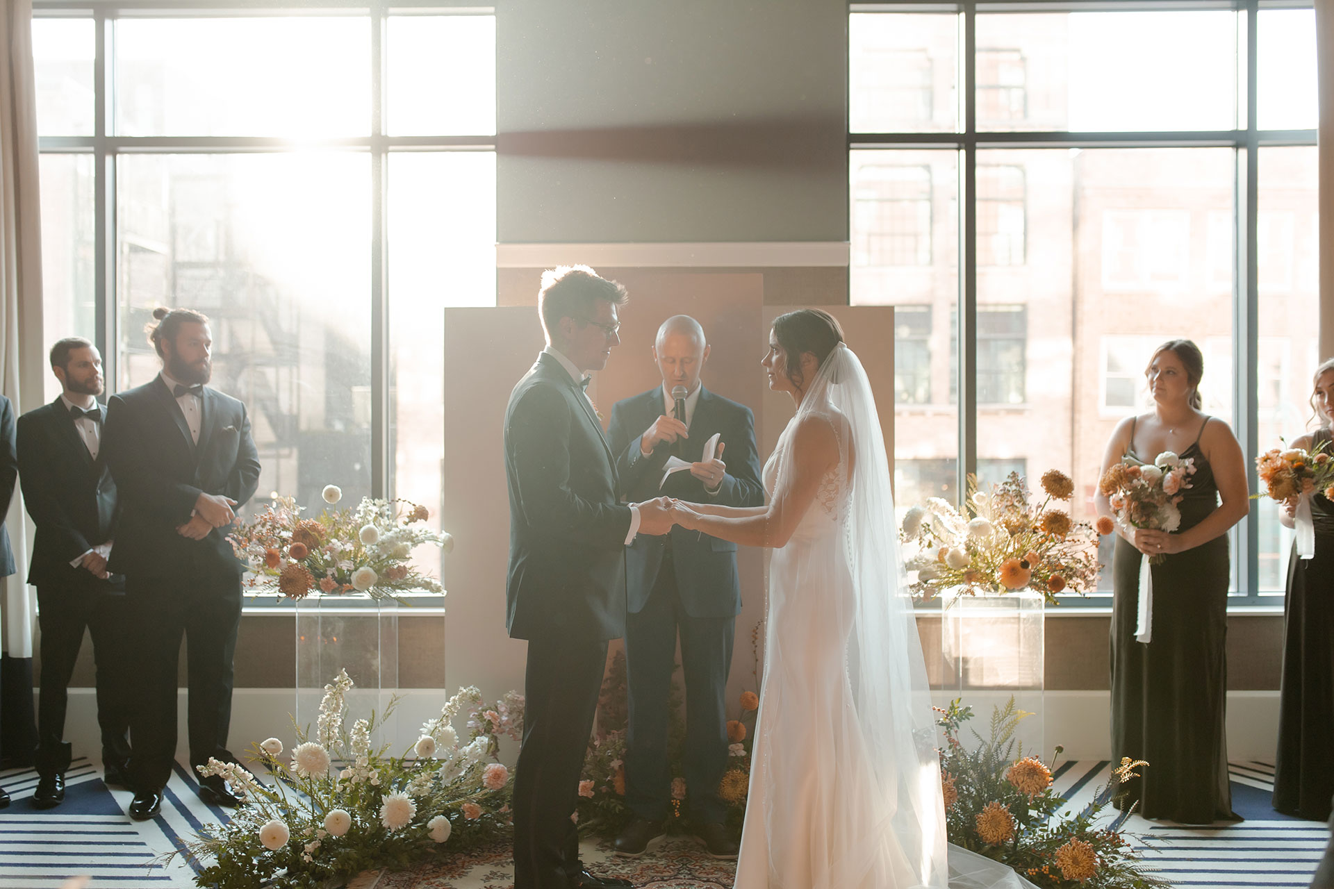 Downtown Milwaukee, trendy wedding with bright florals. Photographed by Claire Neville Photography.