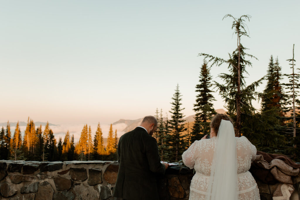 A couple elopes at sunrise in Mount Rainier National Park in Washington