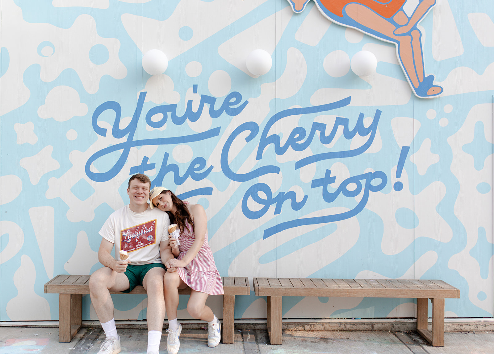 MK and Kyle celebrated their two-year anniversary with a sweet, candid photo session at Joy Ice Cream in Wauwatosa, WI. Claire Neville Photography captured their laughter, love, and playful moments over colorful cones in a relaxed, documentary style.