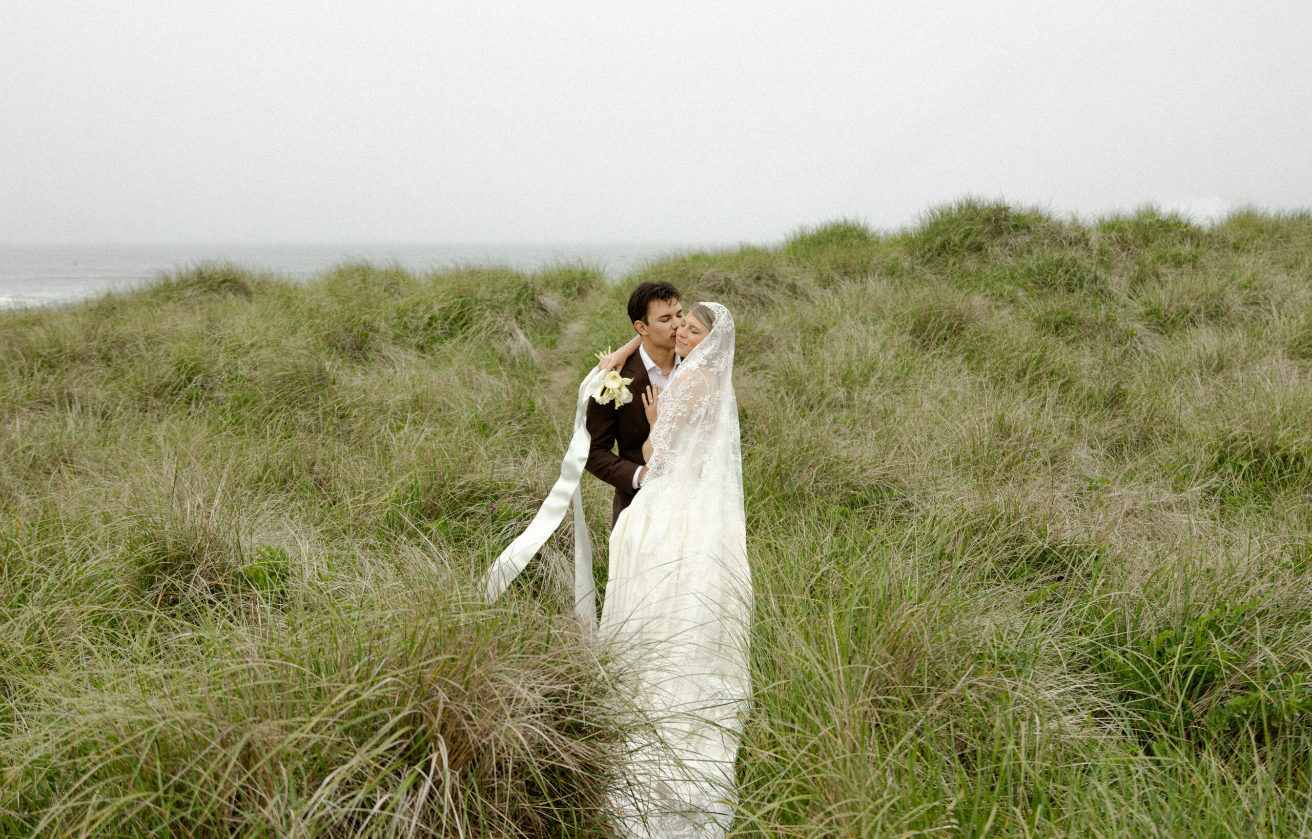 The Oregon coast has a magic all its own. On a misty morning, the air feels fresh and cool. The fog wraps everything in a soft embrace. It creates a dreamy backdrop for a wedding portrait session.